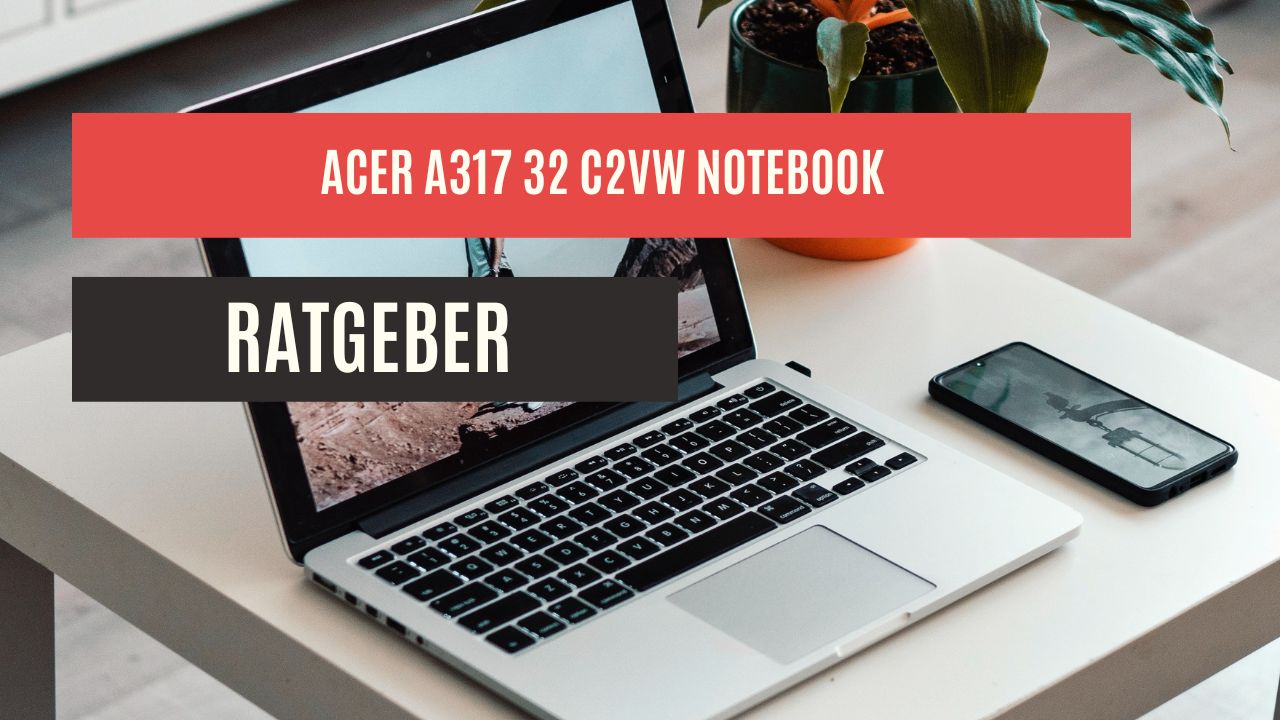 laptop und handy auf einem hellem schreibtisch in einem büro